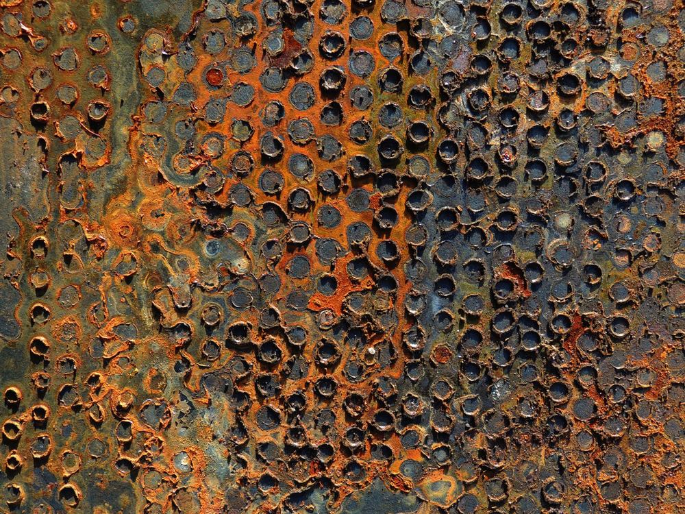 Heavily corroded metal panel surface