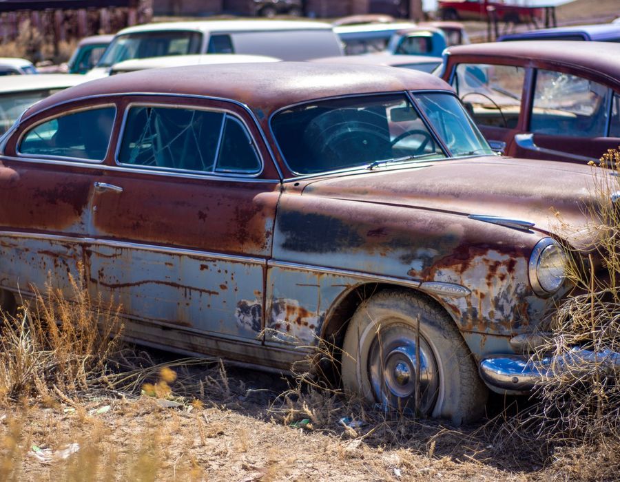 Rusted classic car body needing corrosion repair